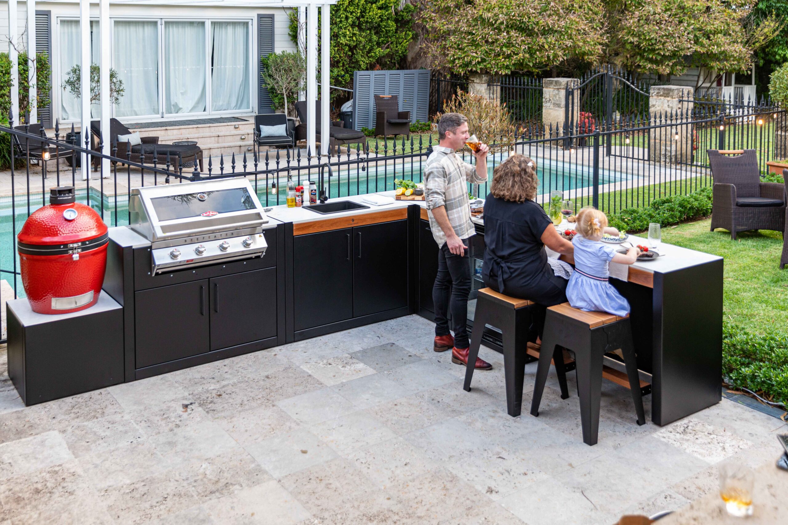 A Family Enjoying a Stonewood Outdoor Kitchen