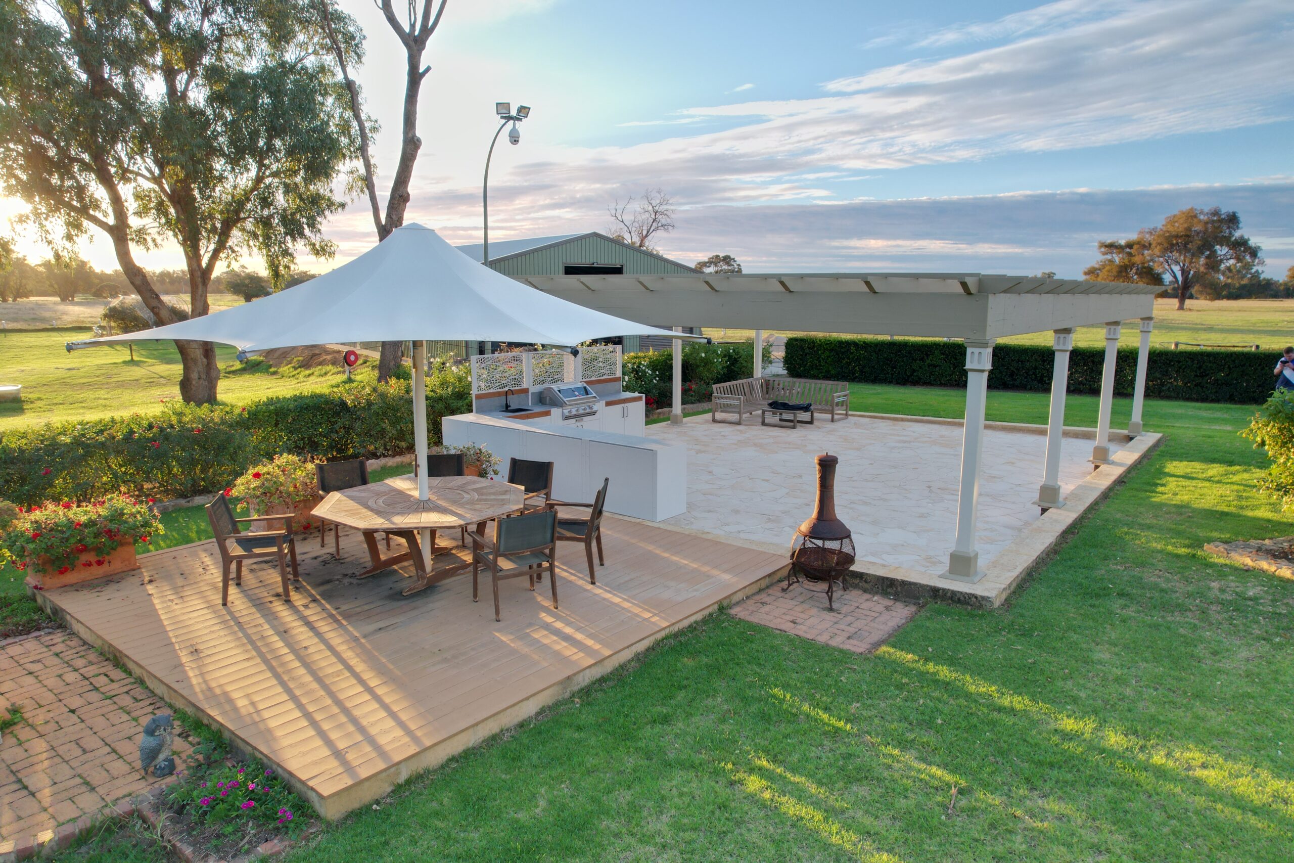 Outdoor Living area with a Stonewood outdoor kitchen and gardens